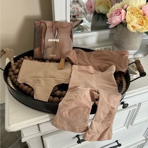 Skims small bundle. Includes XS bodysuit, small bandeau bra, s/m thong & shorts